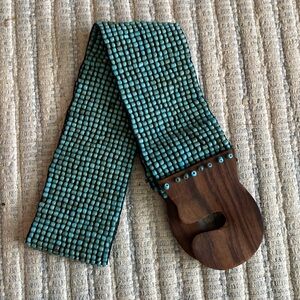 Beaded belt with wood closure